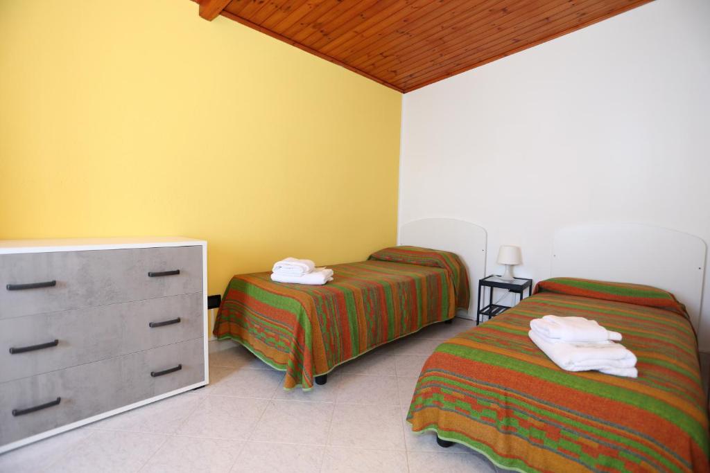 Postel nebo postele na pokoji v ubytování B&B Saracinello