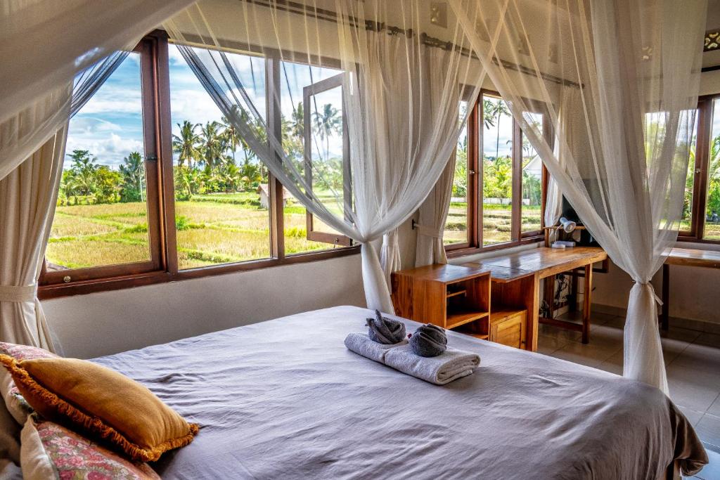 Postel nebo postele na pokoji v ubytování Buddha Homestay