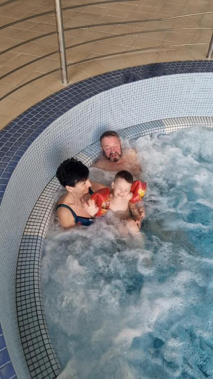 a group of people in a swimming pool at Albatros Medical SPA in Mielno