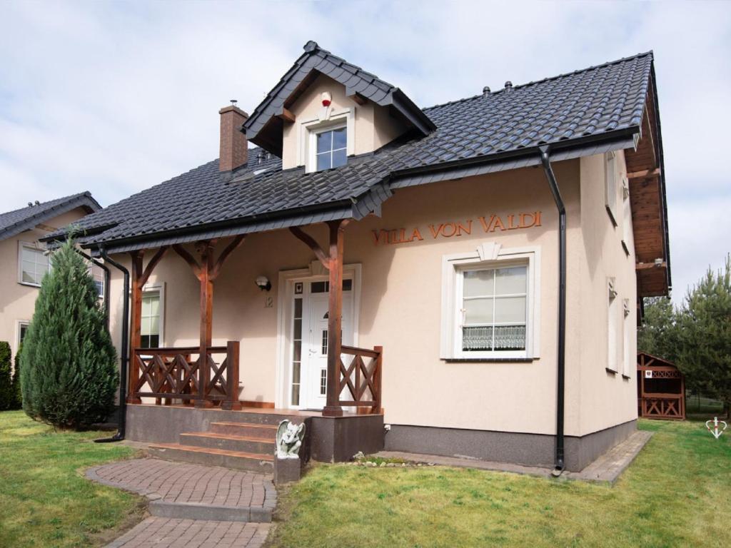 a house with a sign that reads take your yard at Holiday Home Villa von Valdi by Interhome in Władysławowo