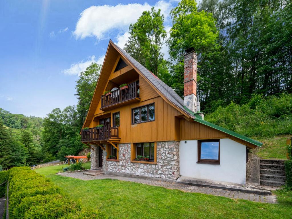 a house with a balcony on top of it at Chalet Mrklov by Interhome in Mrklov