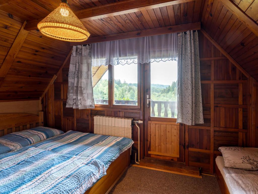 Postel nebo postele na pokoji v ubytování Chalet Mrklov by Interhome