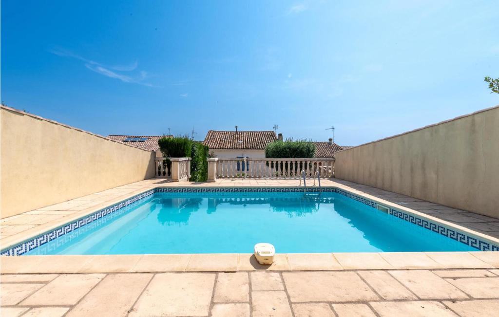 a swimming pool in a house with a fence at 4 Bedroom Lovely Home In Magalas in Magalas