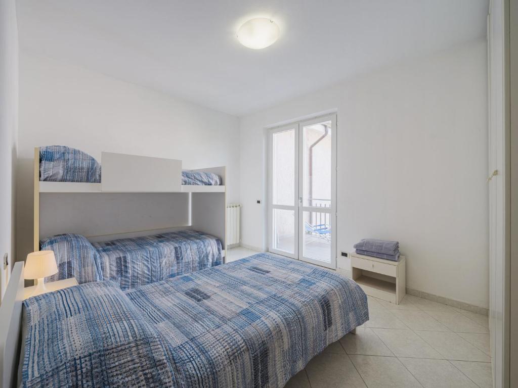 Llit o llits en una habitació de Holiday Home Lucerna Due-3 by Interhome