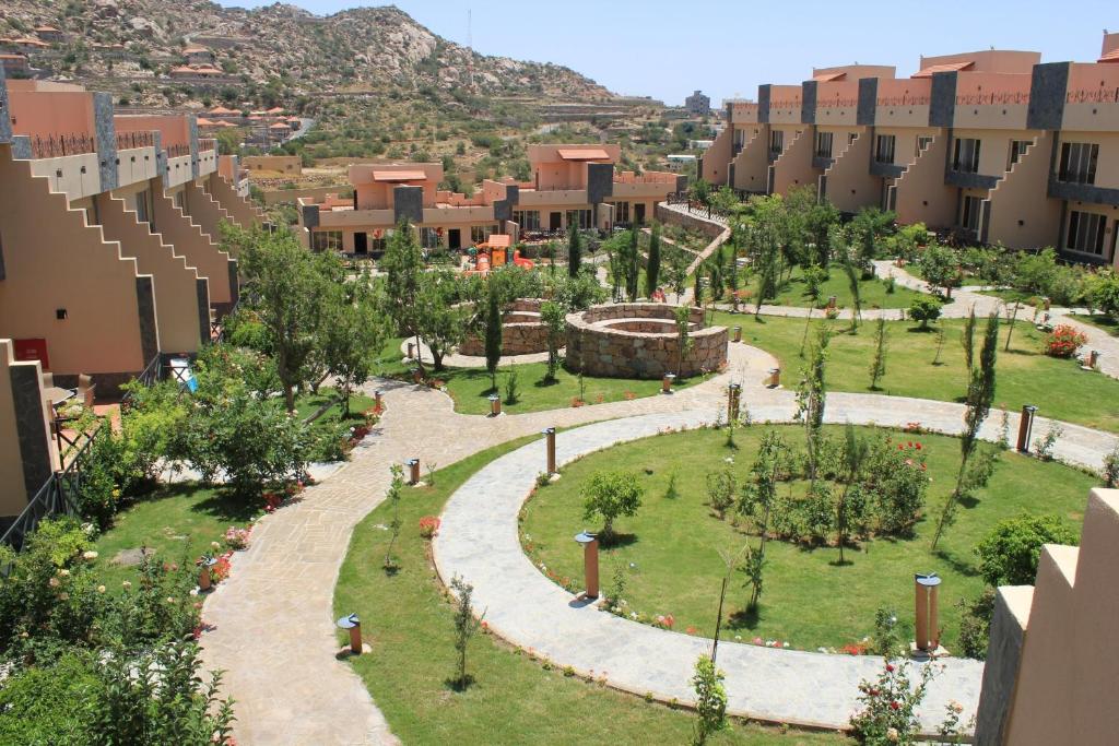 an aerial view of a park with buildings at Al Wadi Touristic Resort in Al Shafa