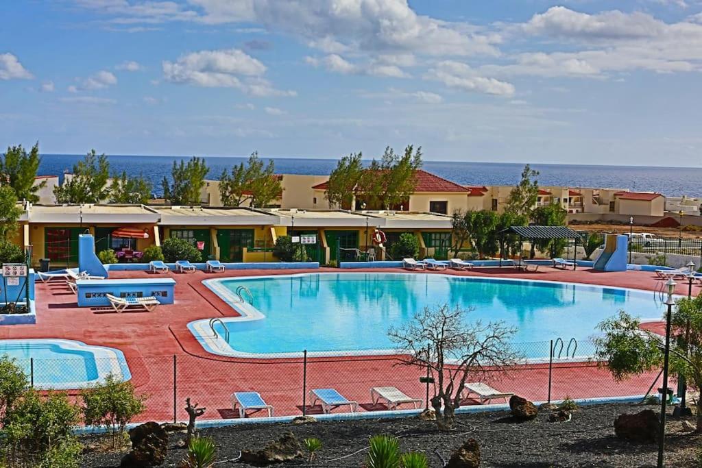 a large swimming pool in a resort at FELIX HOUSE sea views in Costa de Antigua