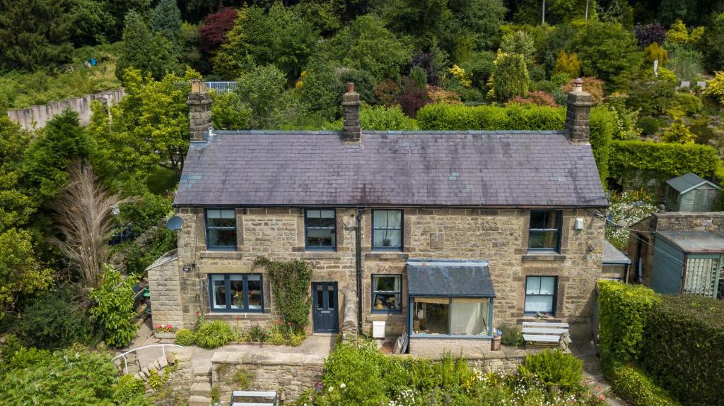 an aerial view of a stone house with a roof at Abbeville in Two Dales