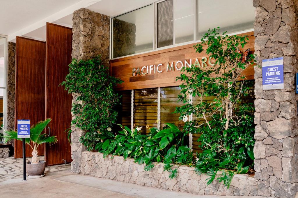 a store front of a building with plants at Pacific Monarch Hotel in Honolulu