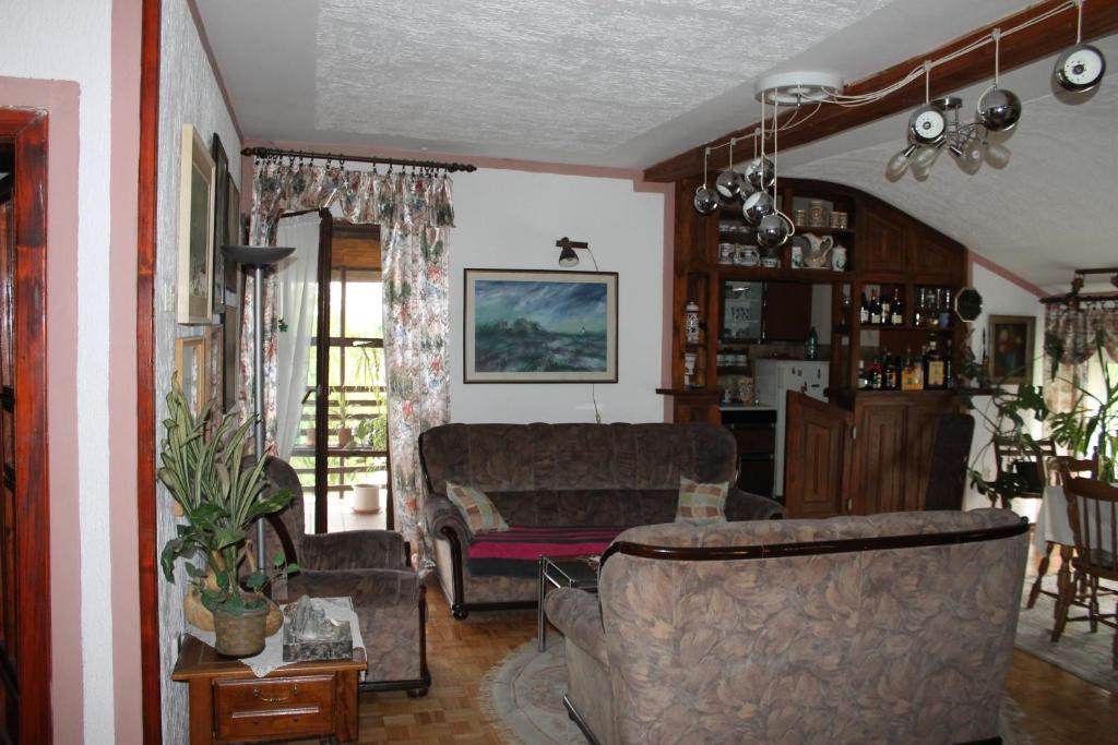 a living room with a couch and a table at Apartment Relax in Zrenjanin