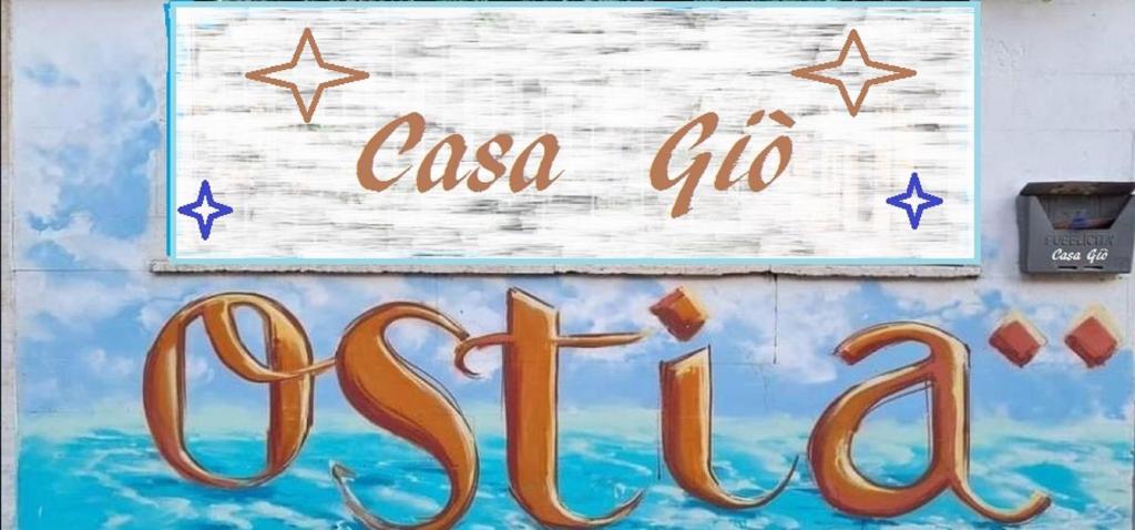 una señal que dice casco giva en una pared en Casa Giò en Lido di Ostia