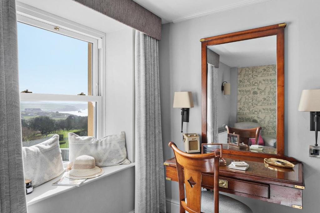 a room with a desk and a window at Thurlestone Hotel in Thurlestone