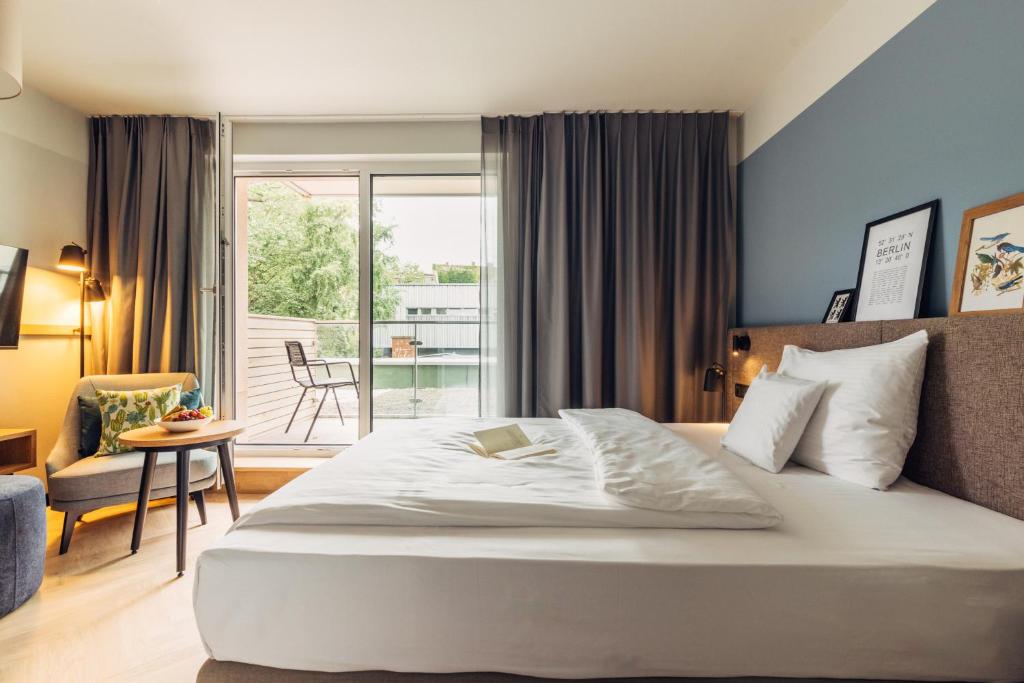 Postel nebo postele na pokoji v ubytování harry's home Berlin-Moabit hotel & apartments