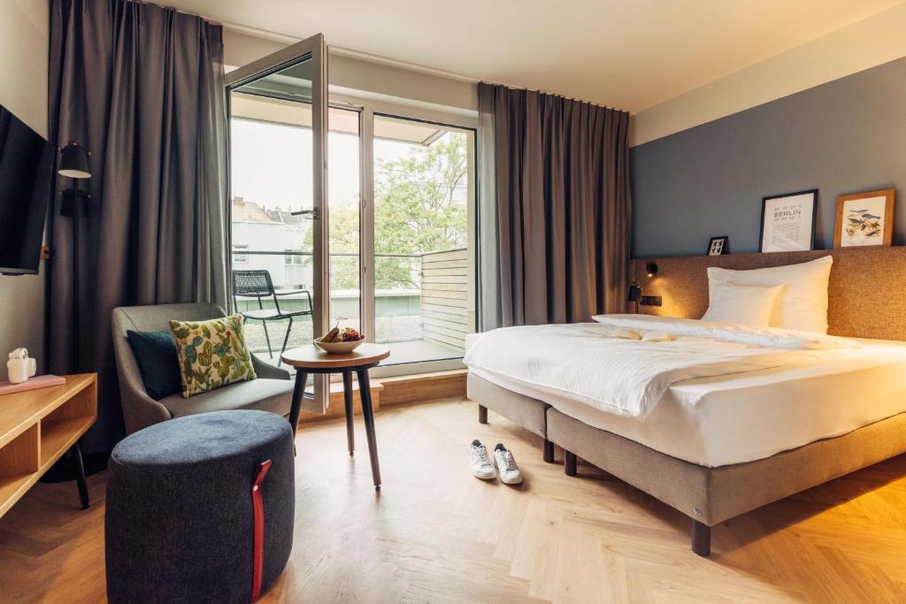 Postel nebo postele na pokoji v ubytování harry's home Berlin-Moabit hotel & apartments
