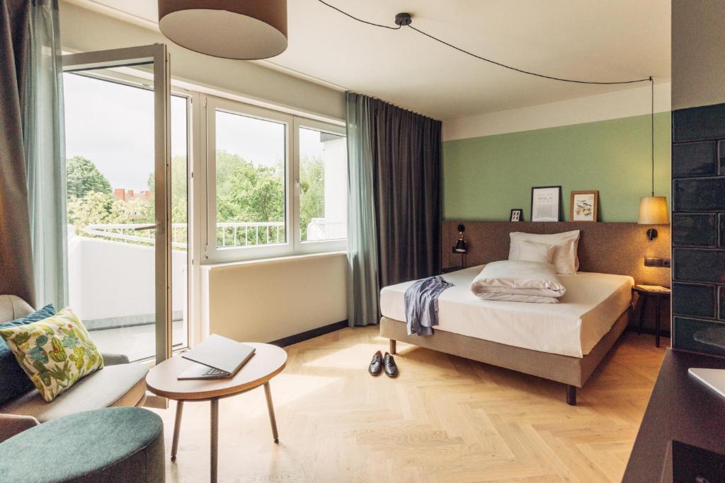 Postel nebo postele na pokoji v ubytování harry's home Berlin-Moabit hotel & apartments