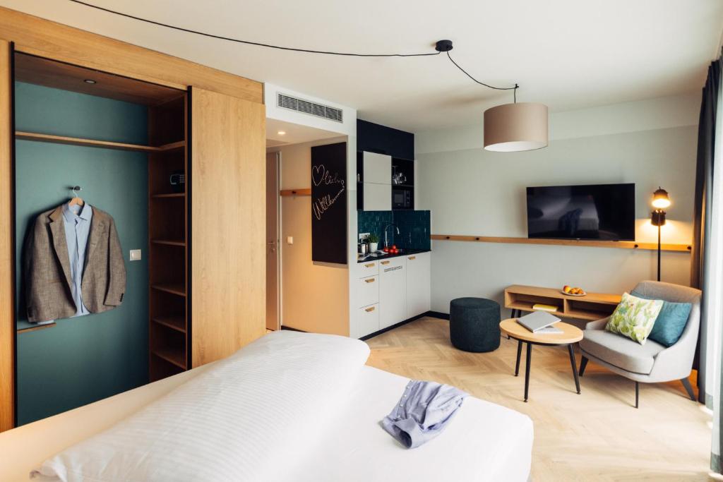 Postel nebo postele na pokoji v ubytování harry's home Berlin-Moabit hotel & apartments
