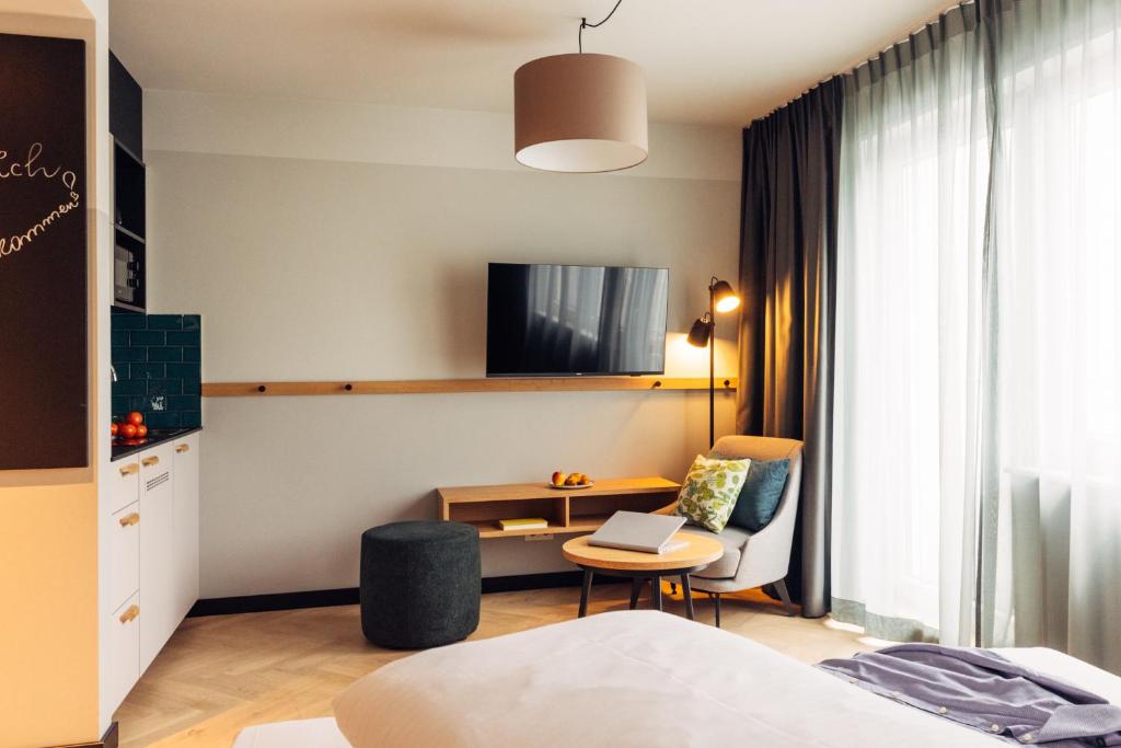 Postel nebo postele na pokoji v ubytování harry's home Berlin-Moabit hotel & apartments
