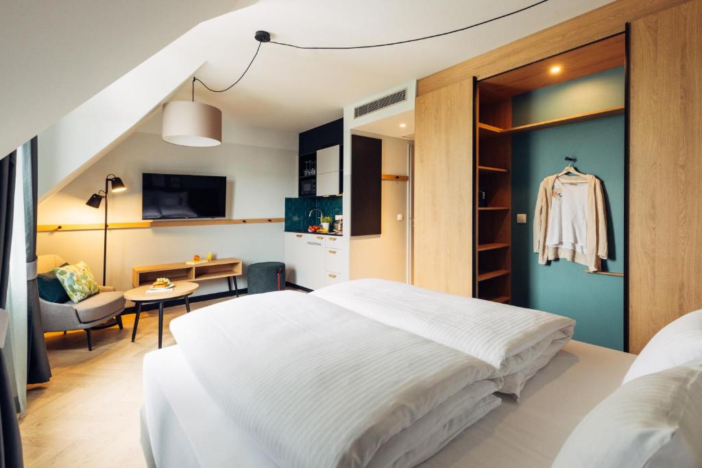 Postel nebo postele na pokoji v ubytování harry's home Berlin-Moabit hotel & apartments