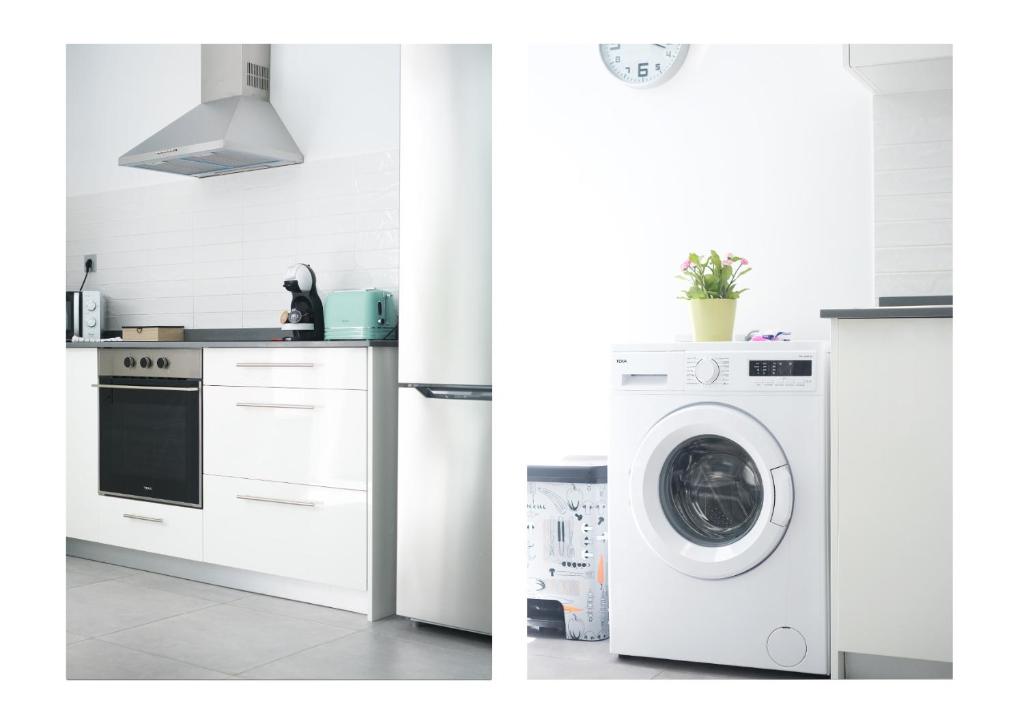 a kitchen with a washer and a washing machine at Karma Famara 2 25m del mar in Famara