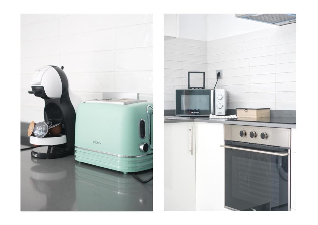 a kitchen with a refrigerator and a microwave and a stove at Karma Famara 2 25m del mar in Famara