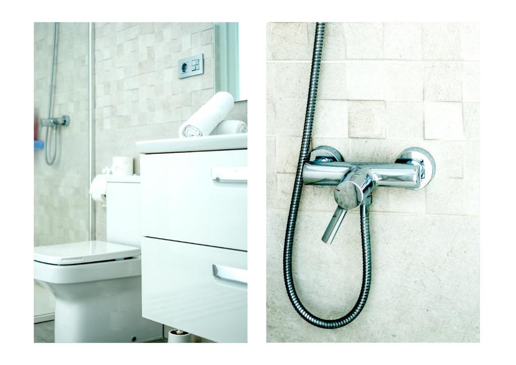 a bathroom with a shower and a toilet at Karma Famara 2 25m del mar in Famara