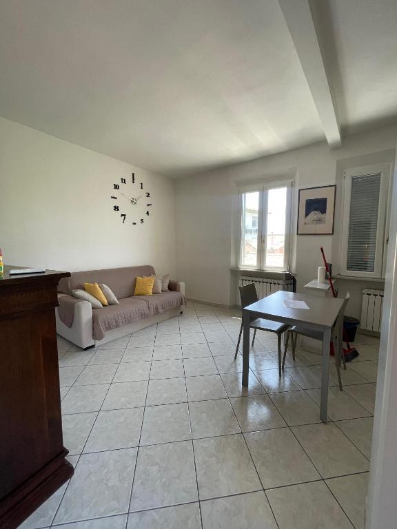 a living room with a couch and a table at My Bnb Pisa in Pisa