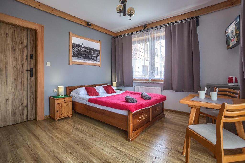 Ένα ή περισσότερα κρεβάτια σε δωμάτιο στο U Studniara