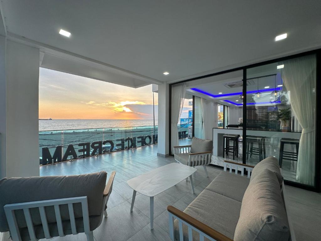 a living room with a view of the ocean at STUNNING BEACHFRONT VIEW LUXURIOUS Apartment 20 in Jomtien Beach