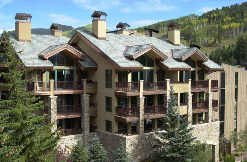 a large apartment building with a roof at Vail Antlers 2 Bedroom Condo in Vail