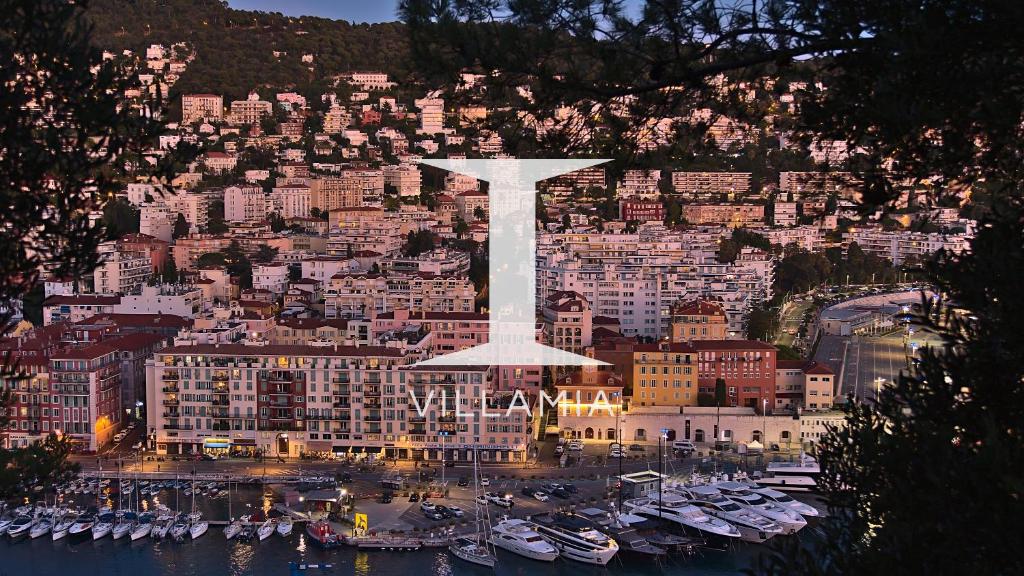 a view of a city with a large white statue at Villa Lotus Penthouse by iVillamia in Nice