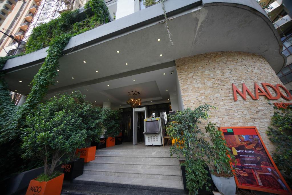 a naya store with plants in front of it at Mado Hotel in Addis Ababa
