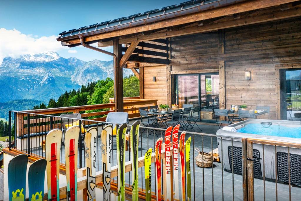 a bunch of surfboards are lined up on a balcony at Chalet Paralpin - OVO Network in Manigod