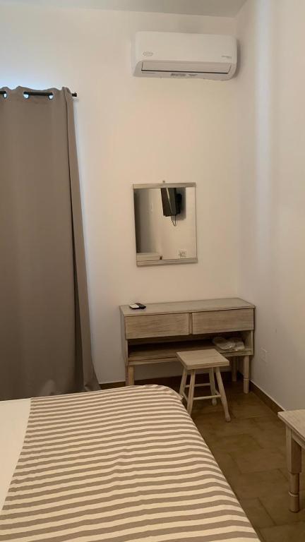 Postel nebo postele na pokoji v ubytování Ψιλή Άμμος