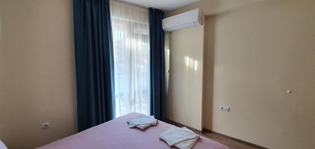 Postel nebo postele na pokoji v ubytování Luxury Apartments Ekaterina