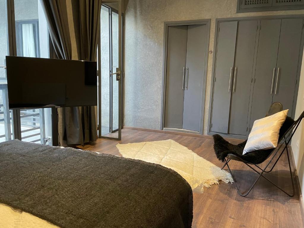 Postel nebo postele na pokoji v ubytování YVES Marrakech