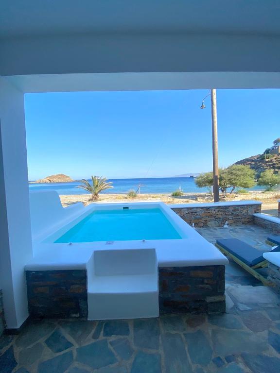 a swimming pool with a view of the ocean at Villa Acta in Kithnos