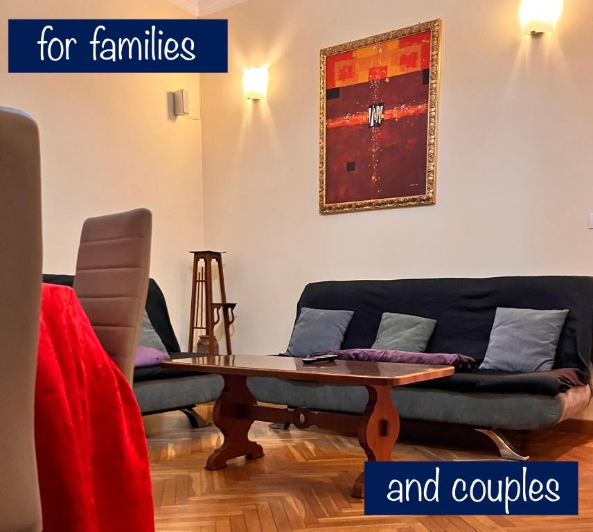 a living room with a couch and a table at Mare e Relax Portosole in Sanremo