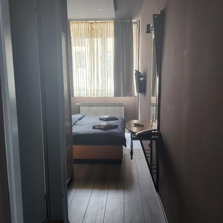 Postel nebo postele na pokoji v ubytování IN CLUB