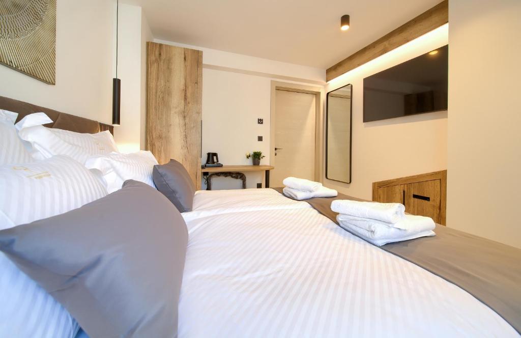 Postel nebo postele na pokoji v ubytování Portella Rooms