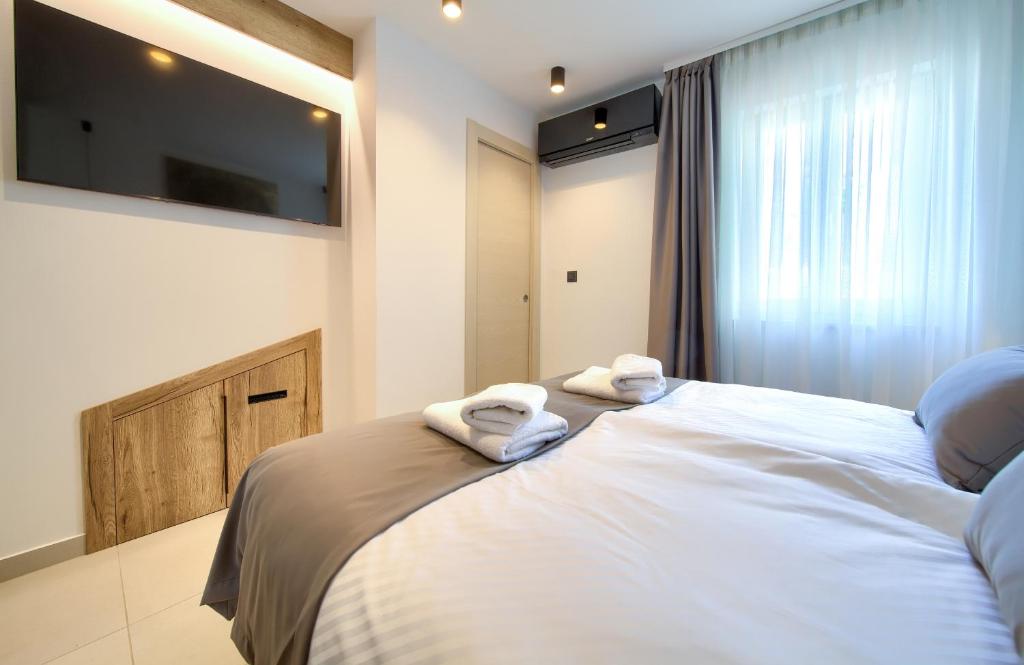 Postel nebo postele na pokoji v ubytování Portella Rooms