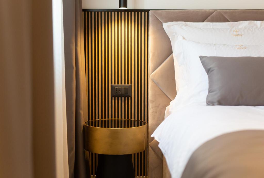 Postel nebo postele na pokoji v ubytování Portella Rooms