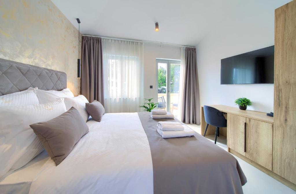 Postel nebo postele na pokoji v ubytování Portella Rooms