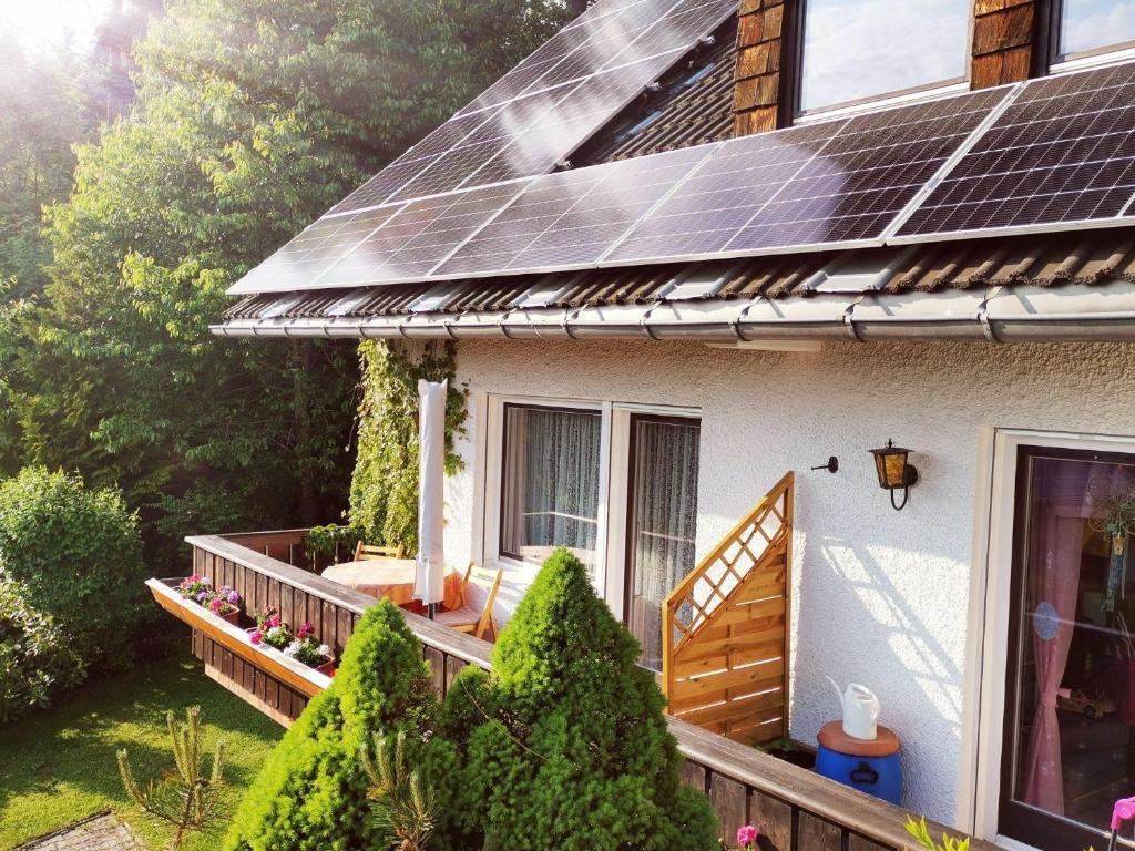 a house with solar panels on the roof at Haus-Daxberg-idyllisch-gelegen-im-Bayerischen-Wald-Ferienwohnung-mit-Zimmer-Kueche-Bad in Eppenschlag