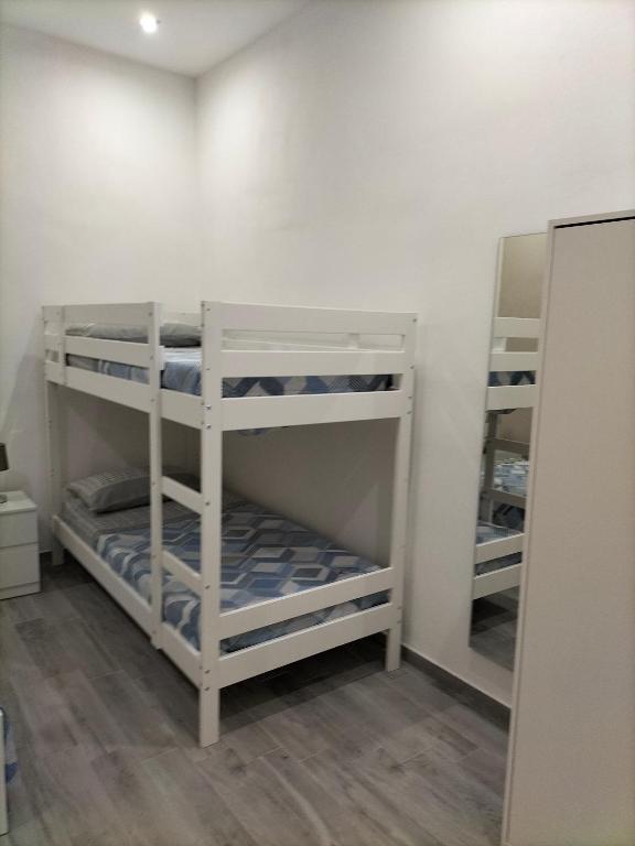 Postel nebo postele na pokoji v ubytování Square House Casa Vacanze