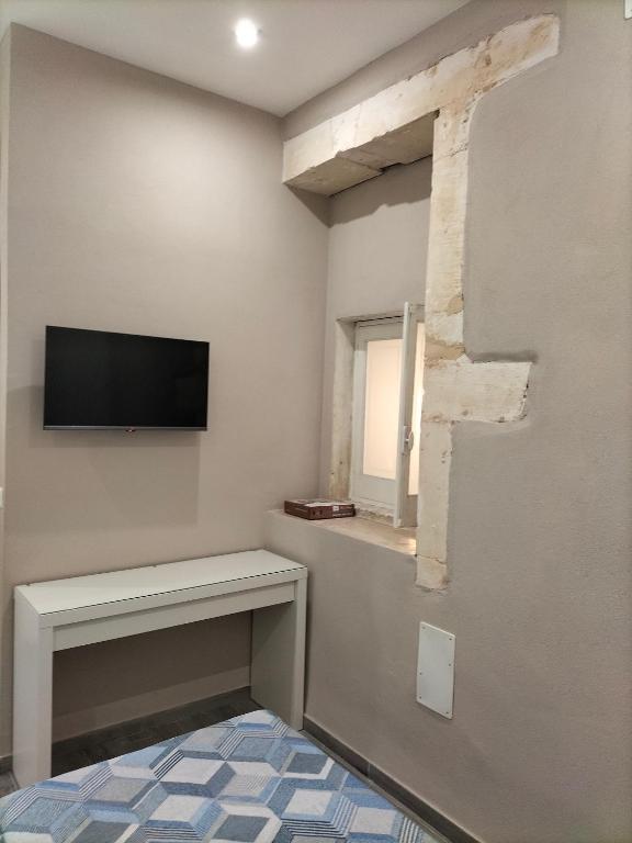 TV a/nebo společenská místnost v ubytování Square House Casa Vacanze