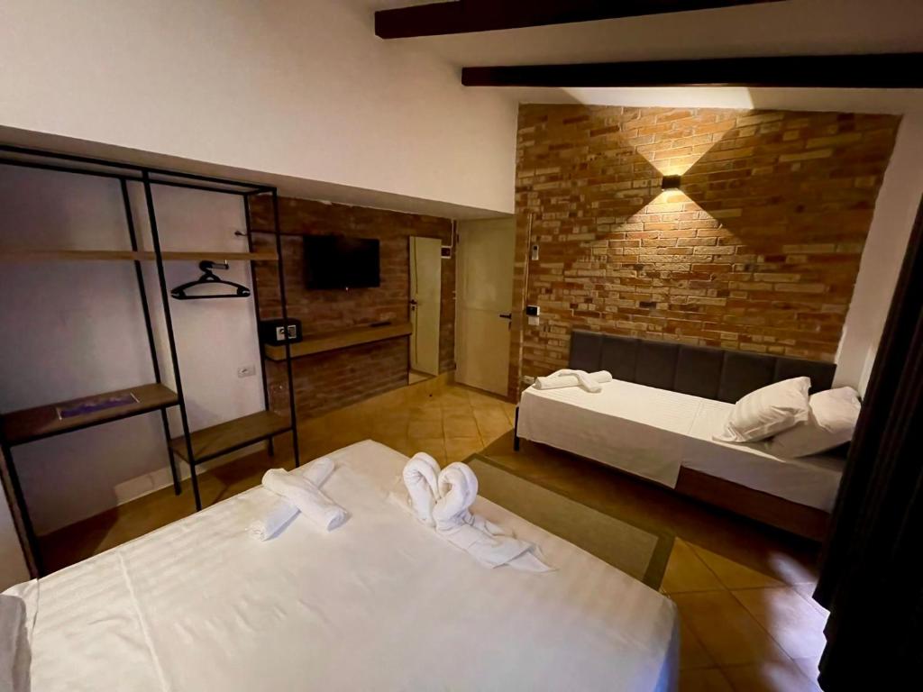 Postel nebo postele na pokoji v ubytování Hotel Kappa3 Villas