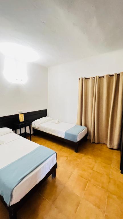 Postel nebo postele na pokoji v ubytování Casa Vicent Campanitx Es Pujols