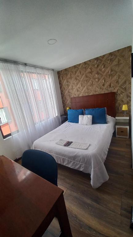 Postel nebo postele na pokoji v ubytování Mosaic House Hotel