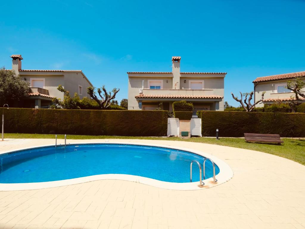 a large blue swimming pool in front of a house at Villa Villa Mallorca by Interhome in Miami Platja