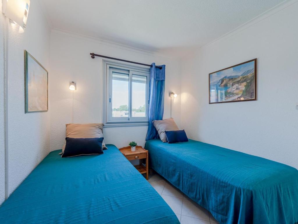 Una cama o camas en una habitaci&oacute;n de Apartment Aigues Marines by Interhome