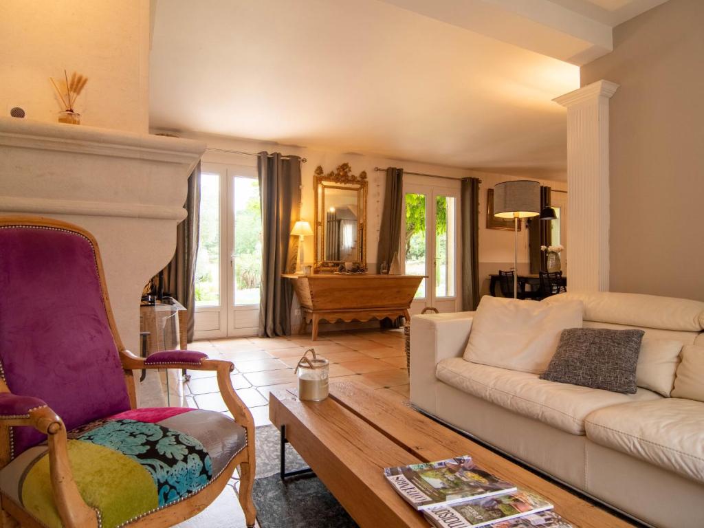 a living room with a couch and a table at Holiday Home La Bastide by Interhome in Tourves